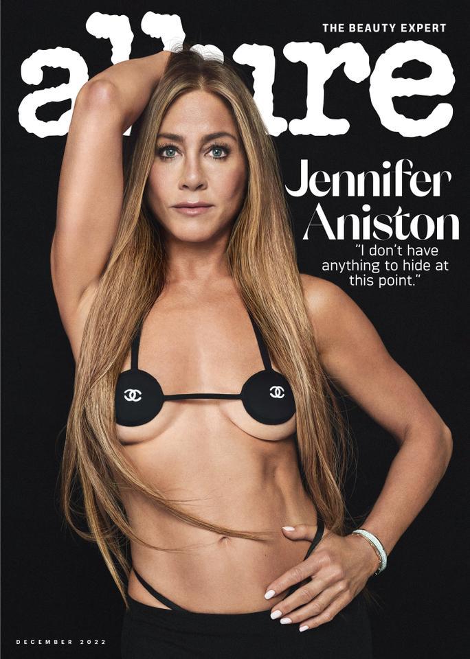 Jennifer Aniston on the cover of Allure Magazine, wearing a vintage Chanel micro bikini top and long, straight hair that flows down to her waist.