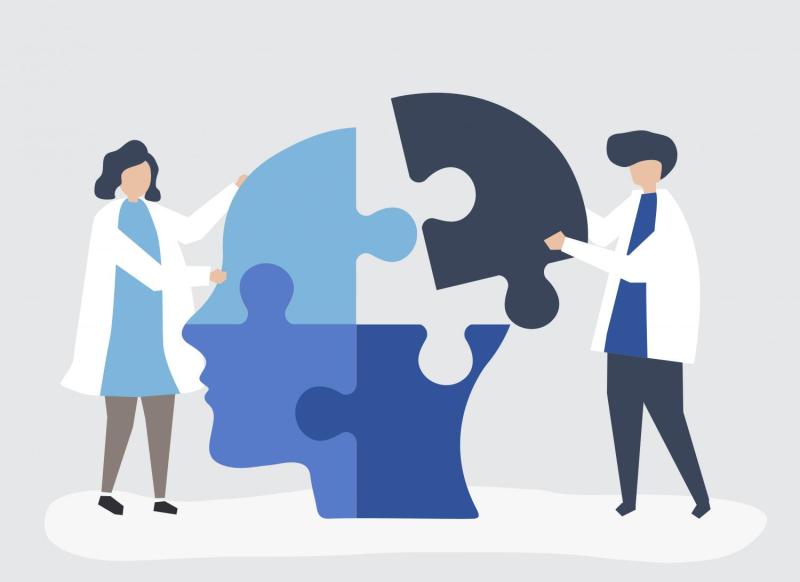 personas armando un puzzle de una cabeza
