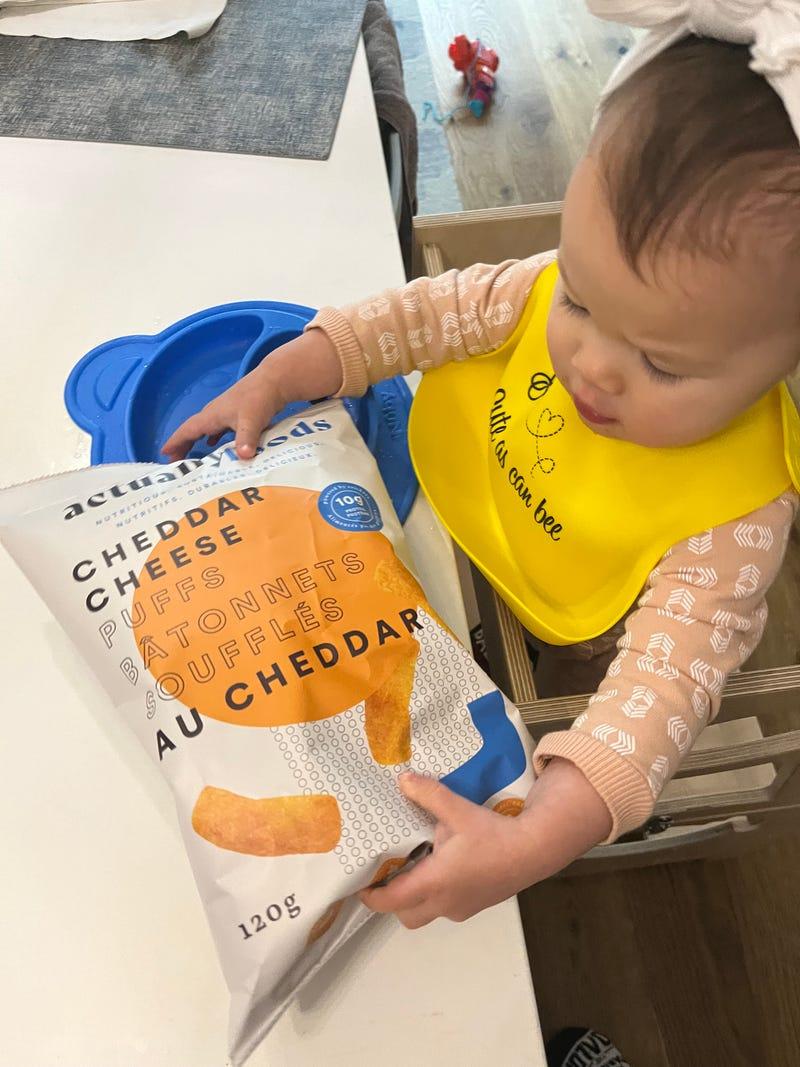 Baby eating cricket puffs