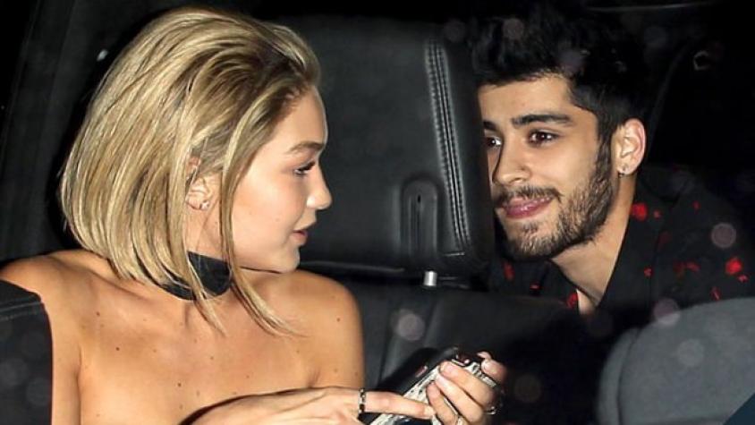 Paparazean a una estilosa Gigi Hadid subiendo al auto con Zayn Malik