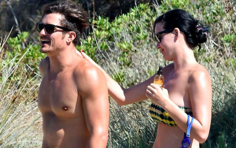 Orlando Bloom es captado desnudo en la playa junto a Katy Perry