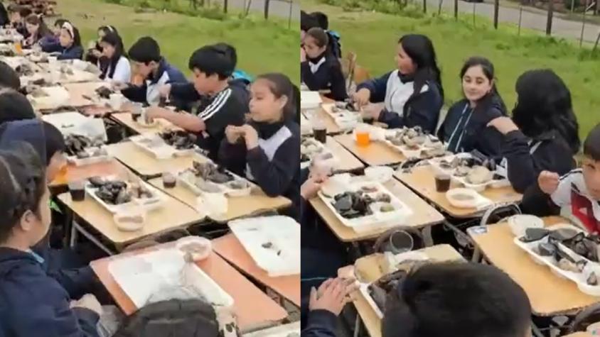 Niños de Ancud comen curanto como si fueran papas fritas