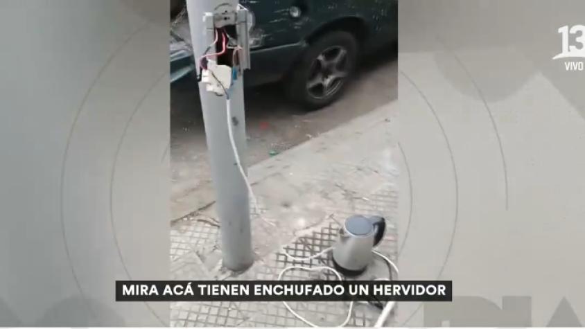 Vecinos denuncian que personas en situación de calle utilizan luminarias para conectar artefactos electrónicos