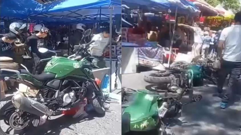 Feroz agresión a Carabineros en Meiggs: sujetos también tiraron sus motocicletas al suelo